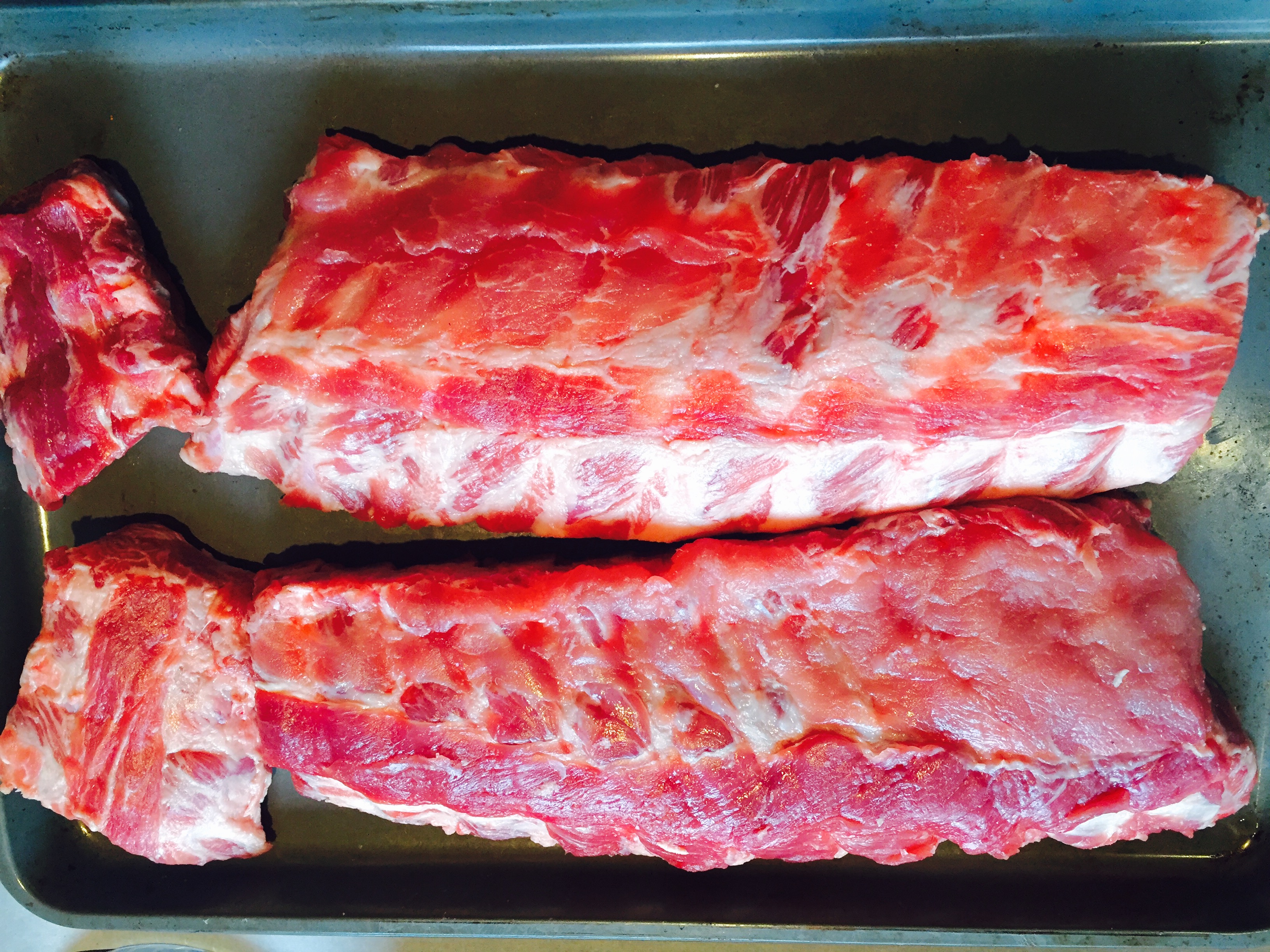 Trimmed baby back pork ribs to make my BBQ'd baked ribs