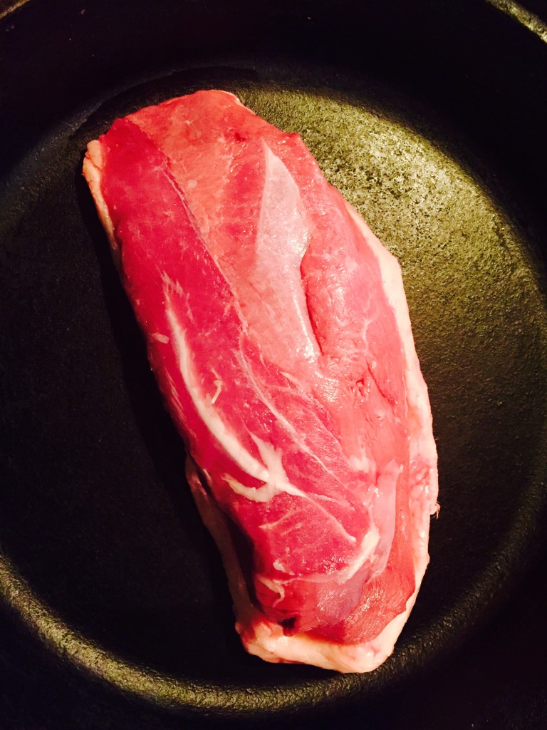 A beautiful fresh local duck-breast starting in a cold cast iron skillet