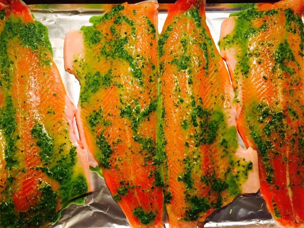 Fresh trout fillets in herbed lemon butter ready for the oven