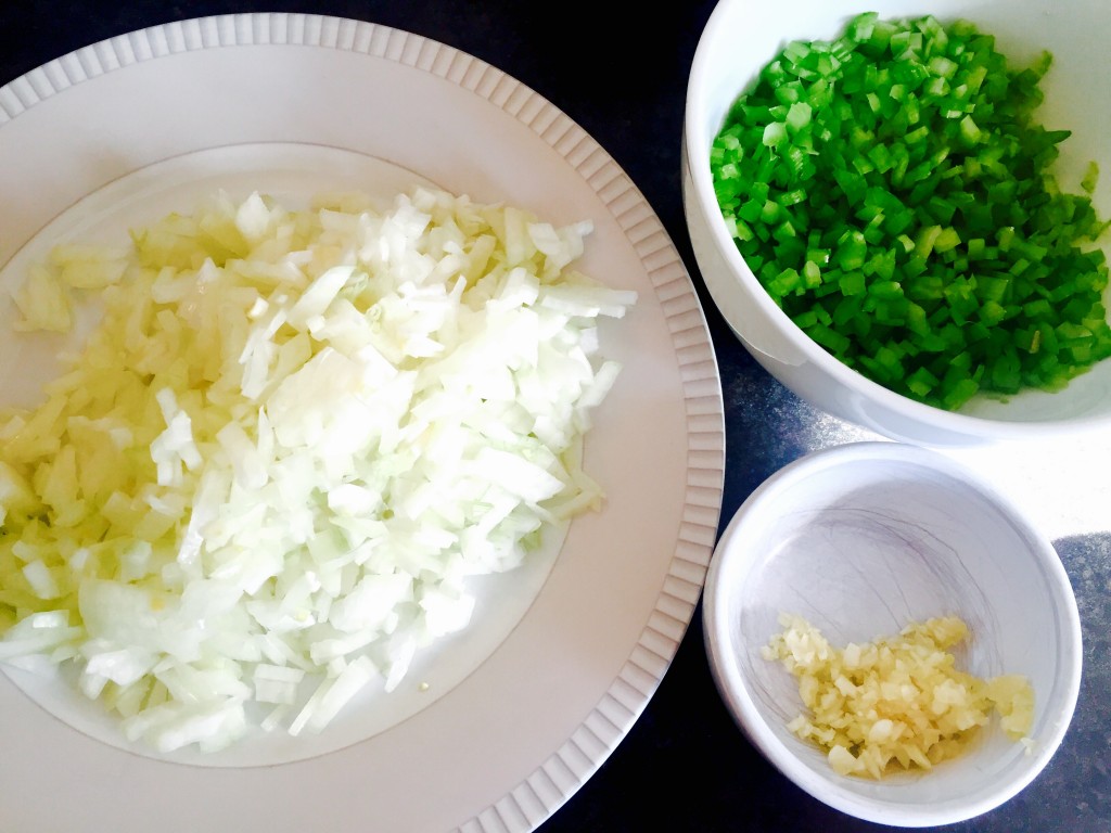 Minced onion, celery and garlic ready to dive into a savoury roux