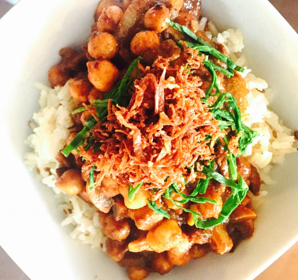 Savoury chana masala served on toasted cumin seed basmati with shredded baby spinach and deep fried grated parsnip