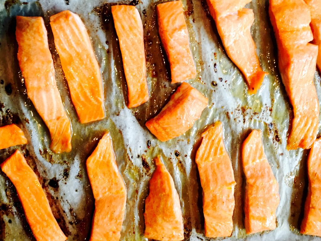 Oven baked trout sliced into finger-food sized strips and ready to be devoured