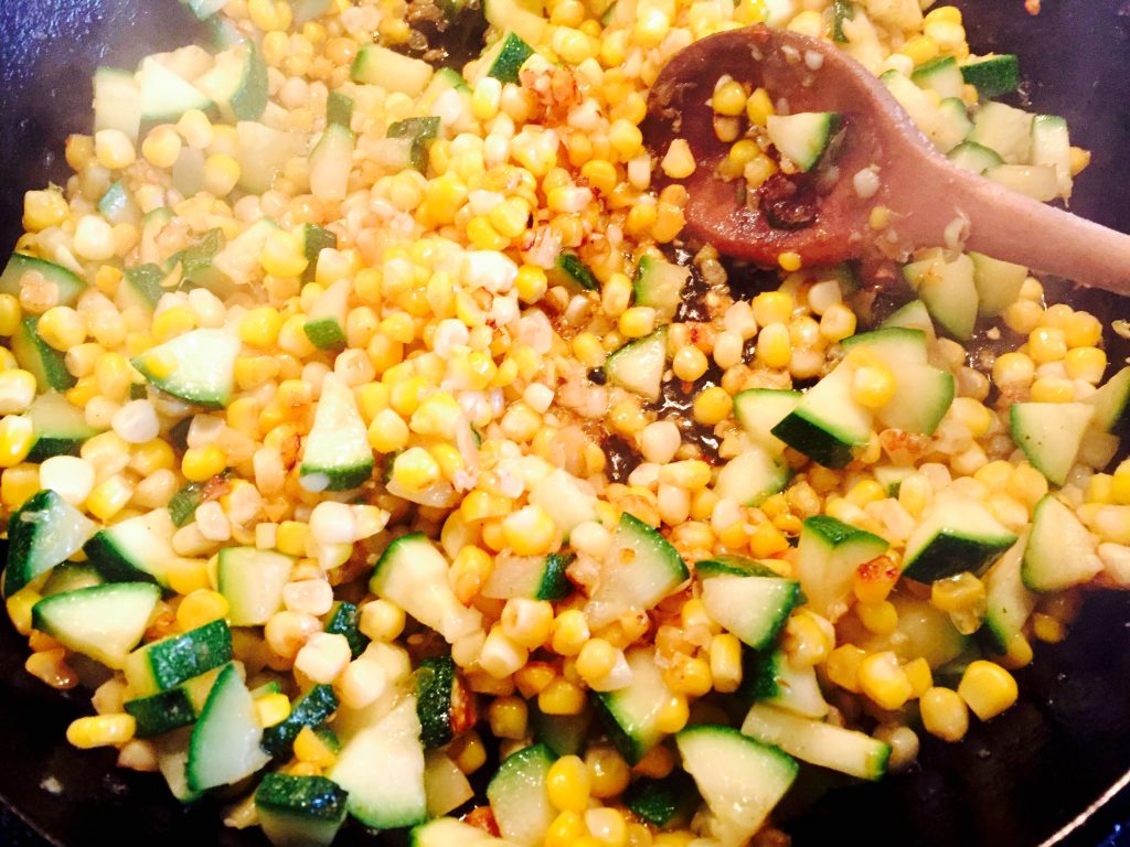 Cooked corn kernels fresh off the cob sautéed with minced onions, garlic and a healthy handful of chopped zucchini
