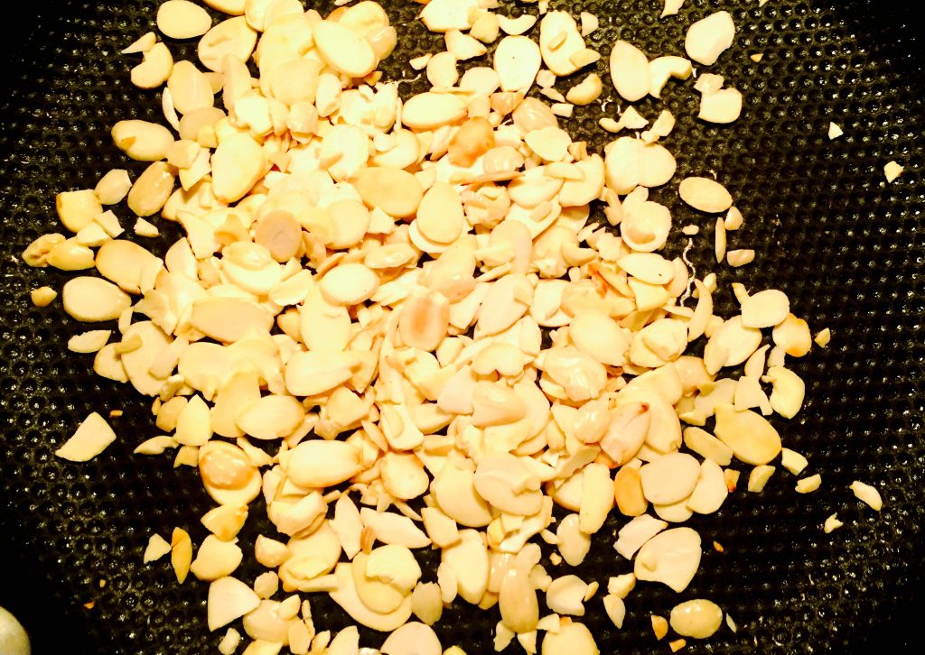 Some crunchy slivered almonds toasting nicely in a dry skillet