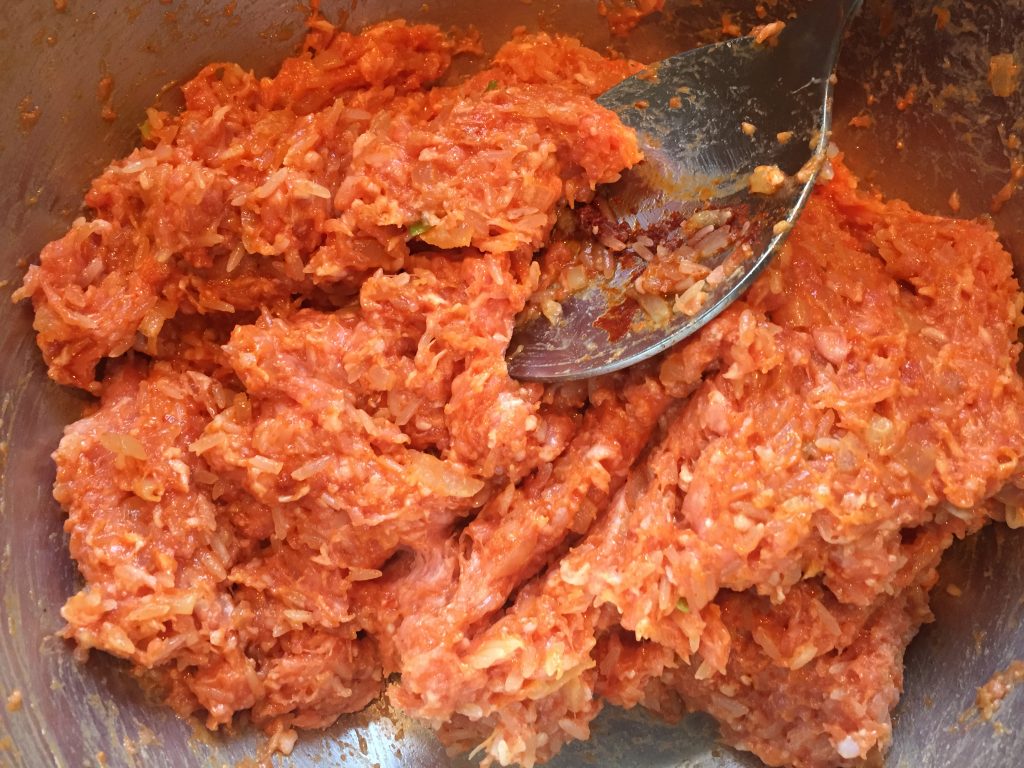 Toltott kaposzta filling with ground pork, seasonings and uncooked white rice