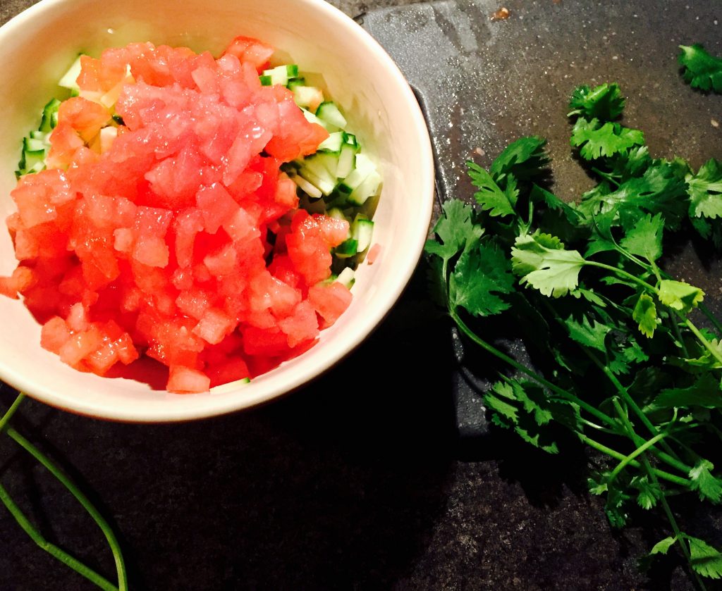 Diced tomatoes, cucumber and red onion with fresh cilantro ready to compliment our tangy shrimp ceviche