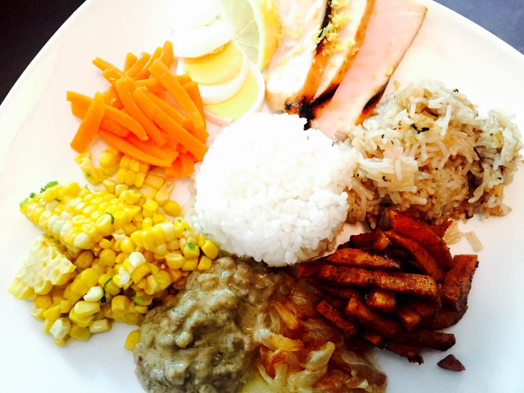 Indonesian nasi campur with bbq grilled blue marlin and a healthy selection of yummy vegetable sides