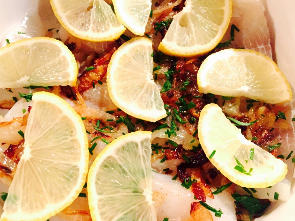 Wonderfully fragrant cod casserole in the Flermish style with wine, lemon, fresh herbs and caramalized onions!