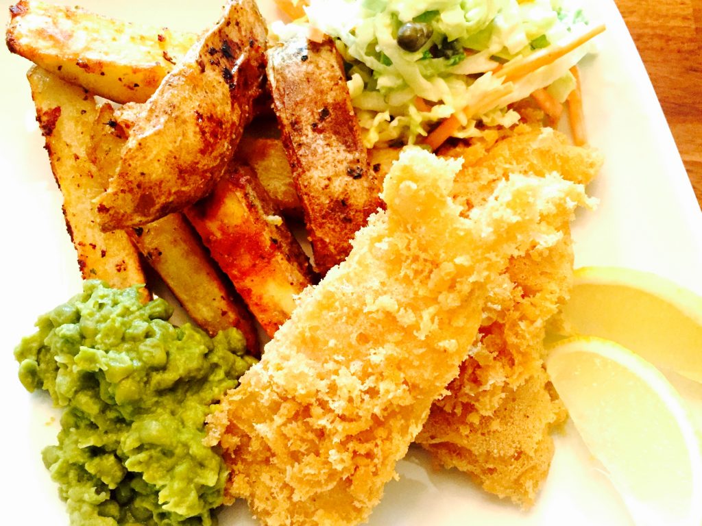 Crispy & delicious gluten free fish and chips with mushy peas, home cut fries and creamy dairy free coleslaw