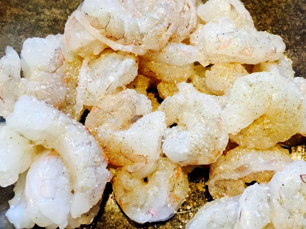 Raw 31-40 tiger shrimp, peeled, cleaned and seasoned with kosher salt and freshly ground black pepper