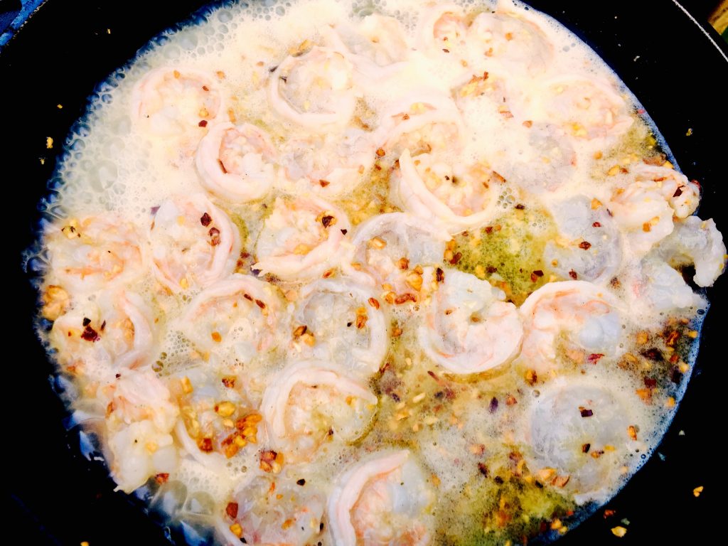 Lucky little shrimps, sautéing happily in a hot cast iron skillet with lots of dairy free margarine, minced garlic and crushed red pepper
