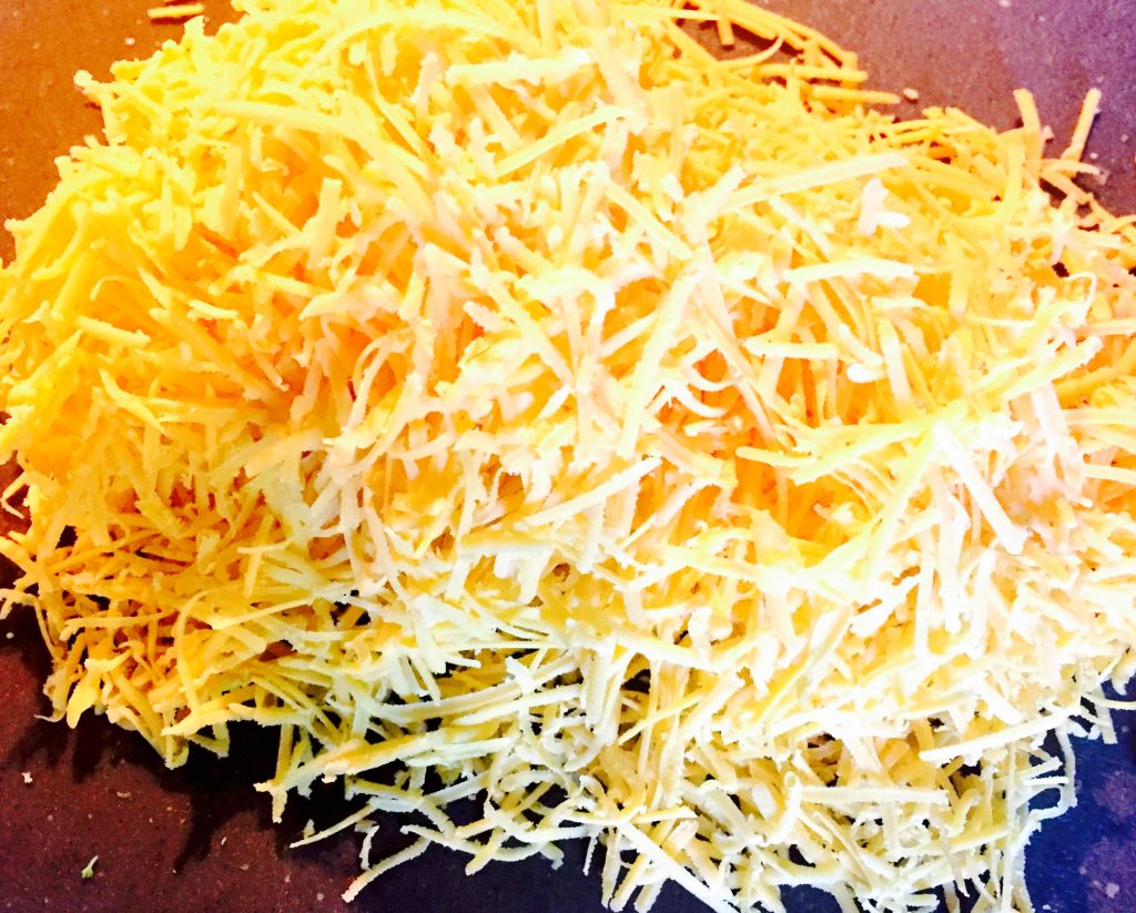 A generous helping of freshly grated dairy free orange cheese