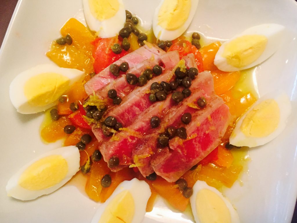 Tunisian Mechouia salad with seared tuna, roasted peppers, broiled tomatoes and a zesty lemon & caper vinaigrette