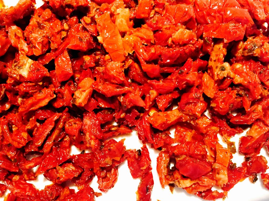 Chopped sun-dried tomatoes, my favourite brand comes packed in a jar with oil that has been deliciously infused with herbs, spices and the lovely tomatoes themselves ... this oil is always my first addition to the salad