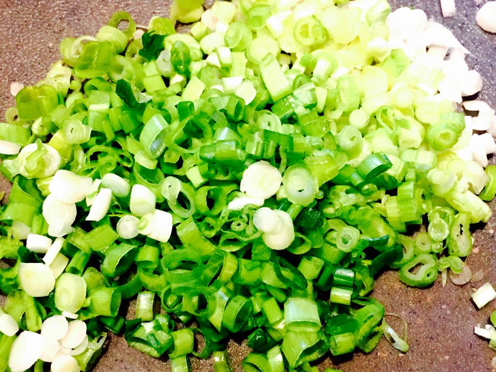 The welcome tang of finely chopped green onions