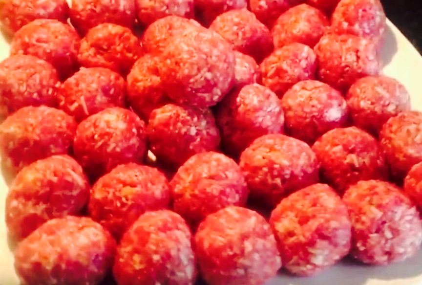 New batch of fresh, homemade meatballs ready to be browned in a non-stick skillet and finished in a 350° oven