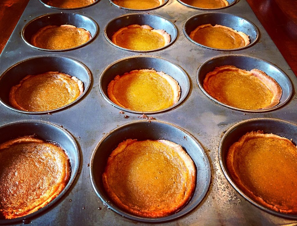 A dozen gorgeous gluten free & dairy free pumpkin butter tarts fresh out of the oven