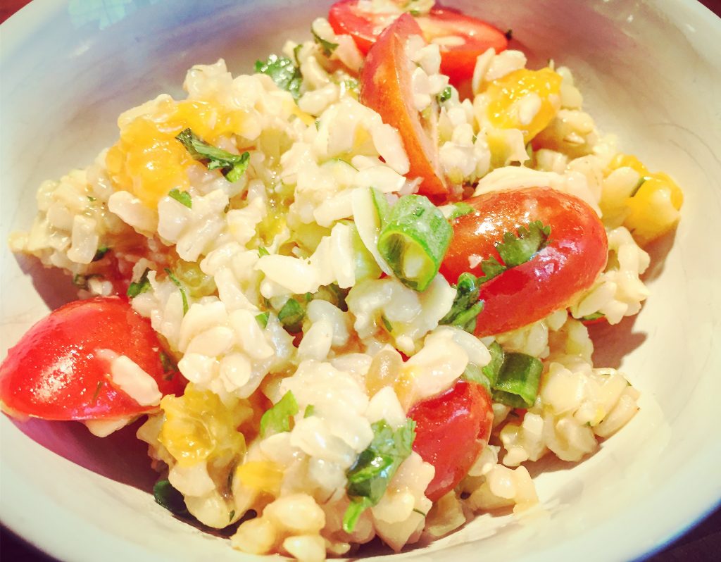 Wholesome brown rice salad with cherry tomatoes, fresh herbs and a tangy vinaigrette