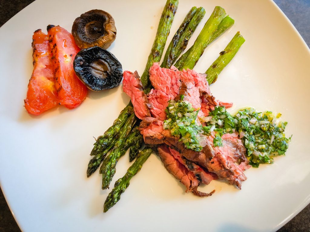 BBQ grilled flap steak (aka bavette steak) with homemade chimichurri and grilled vegetable