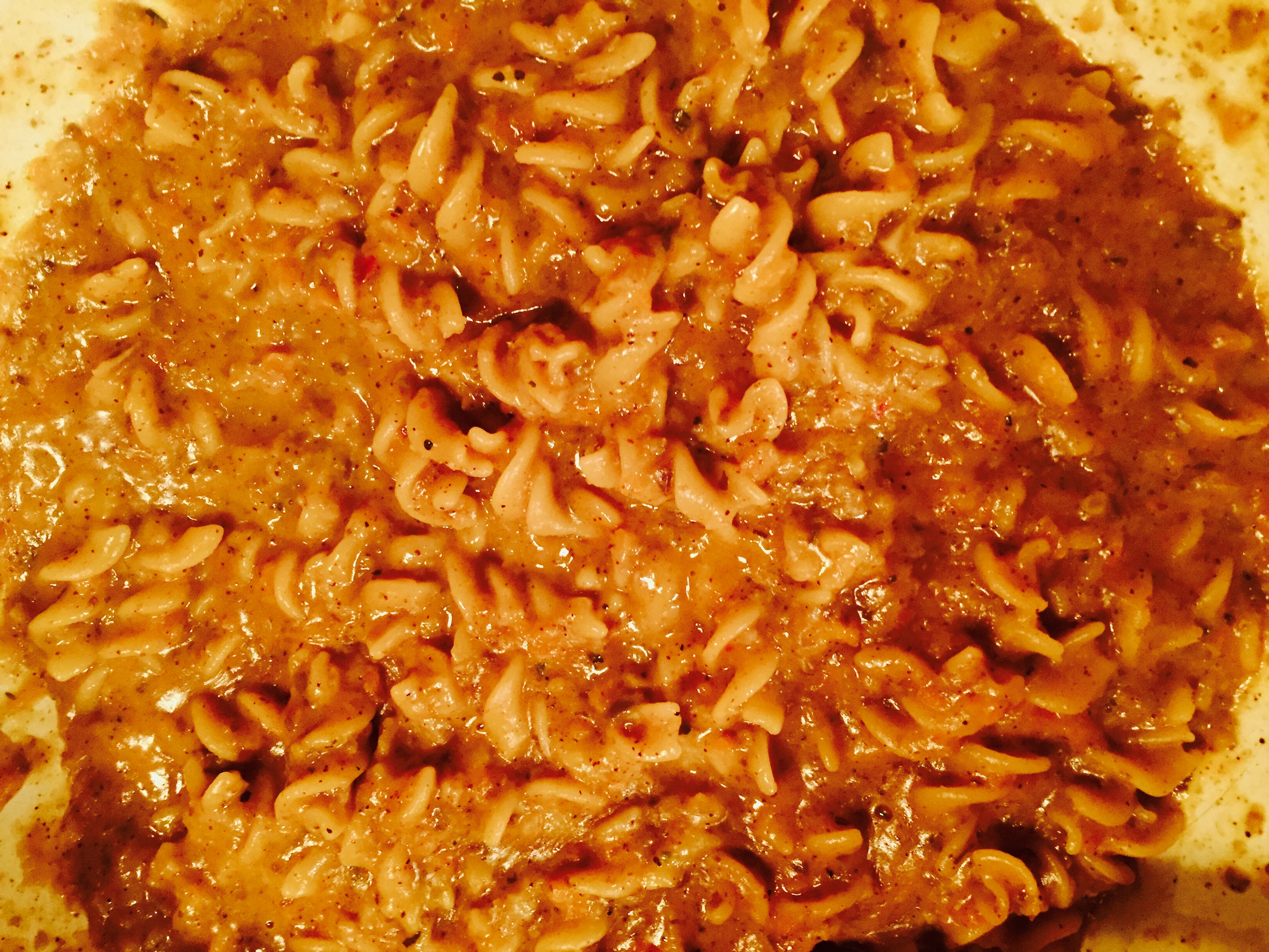 Delicious homemade vegetarian hamburger helper with a side of mild Italian sausage at the ready
