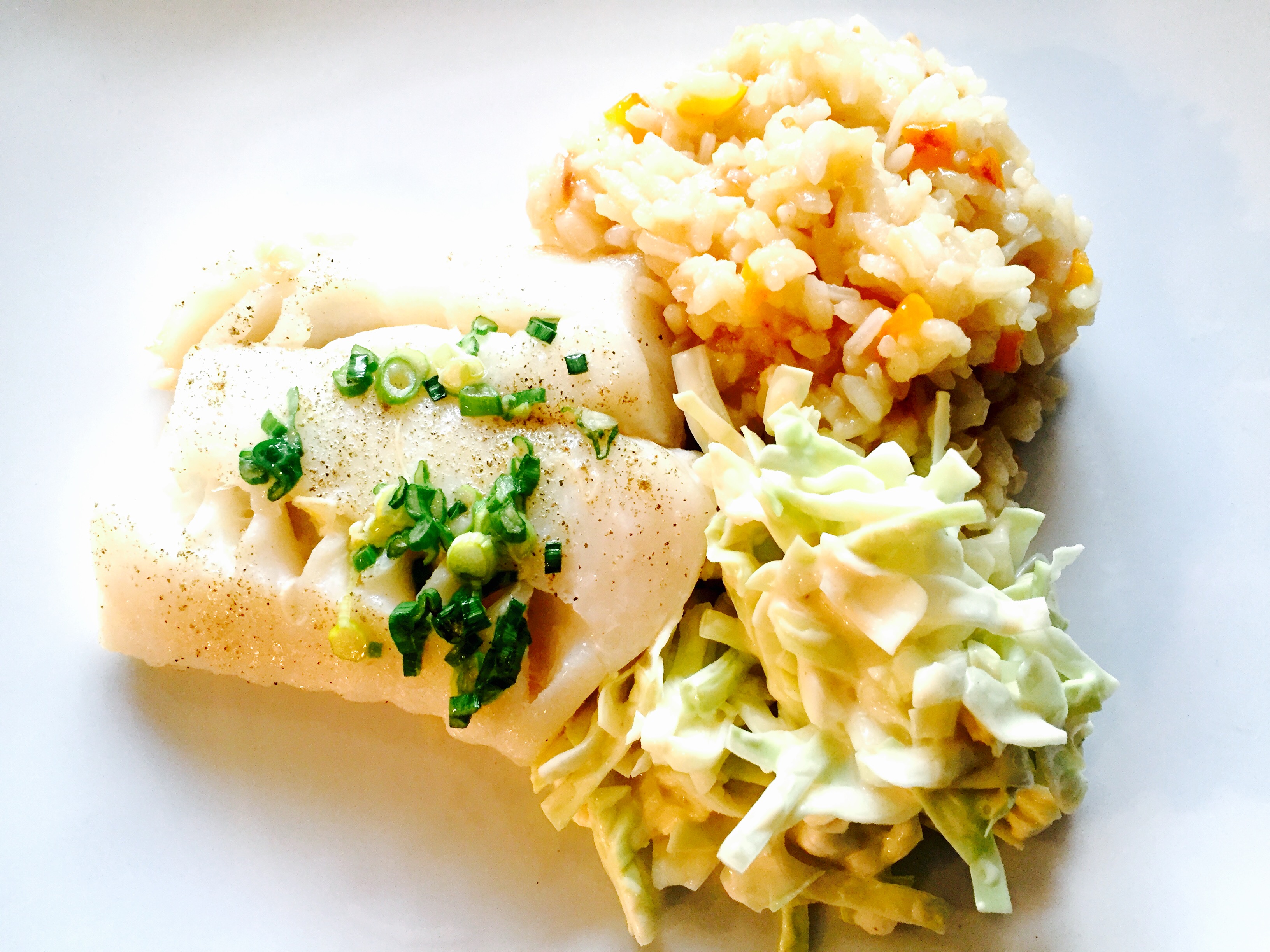 Baked cod with roasted pepper risotto and creamy coleslaw