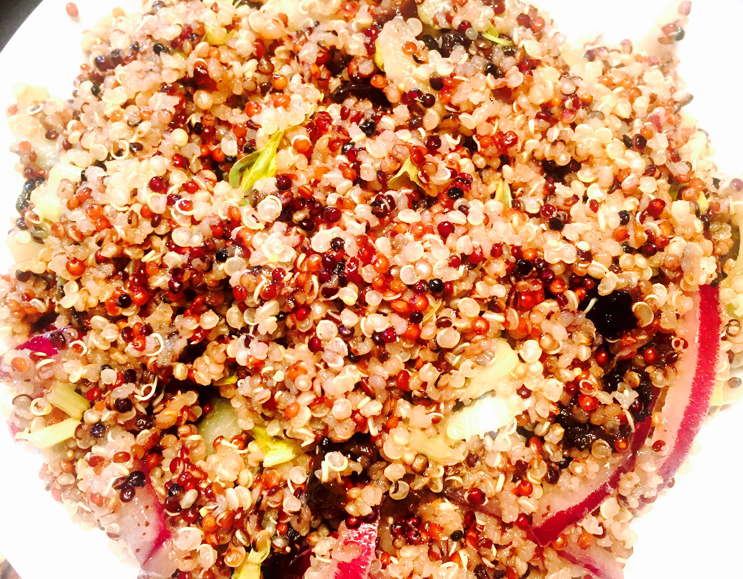 Fresh summer quinoa salad with red onion, black olives and a tangy vinaigrette