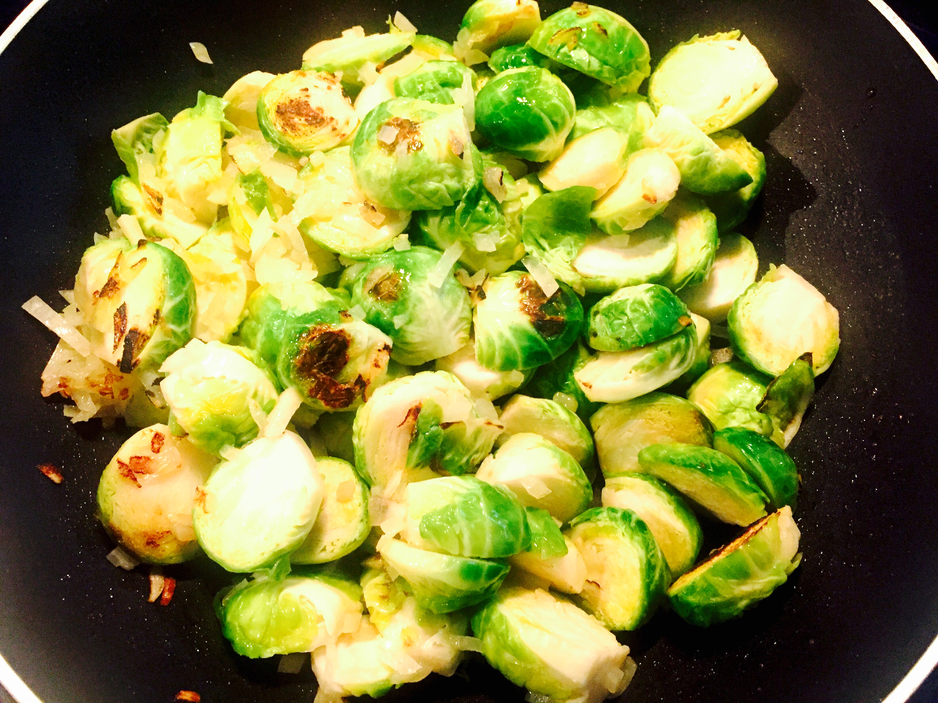 Brussels sprouts that have been field trimmed and halved are sauteed over medium- hi heat until just starting to brown, a splash of wine some lemon zest, cover and simmer for ten minutes.