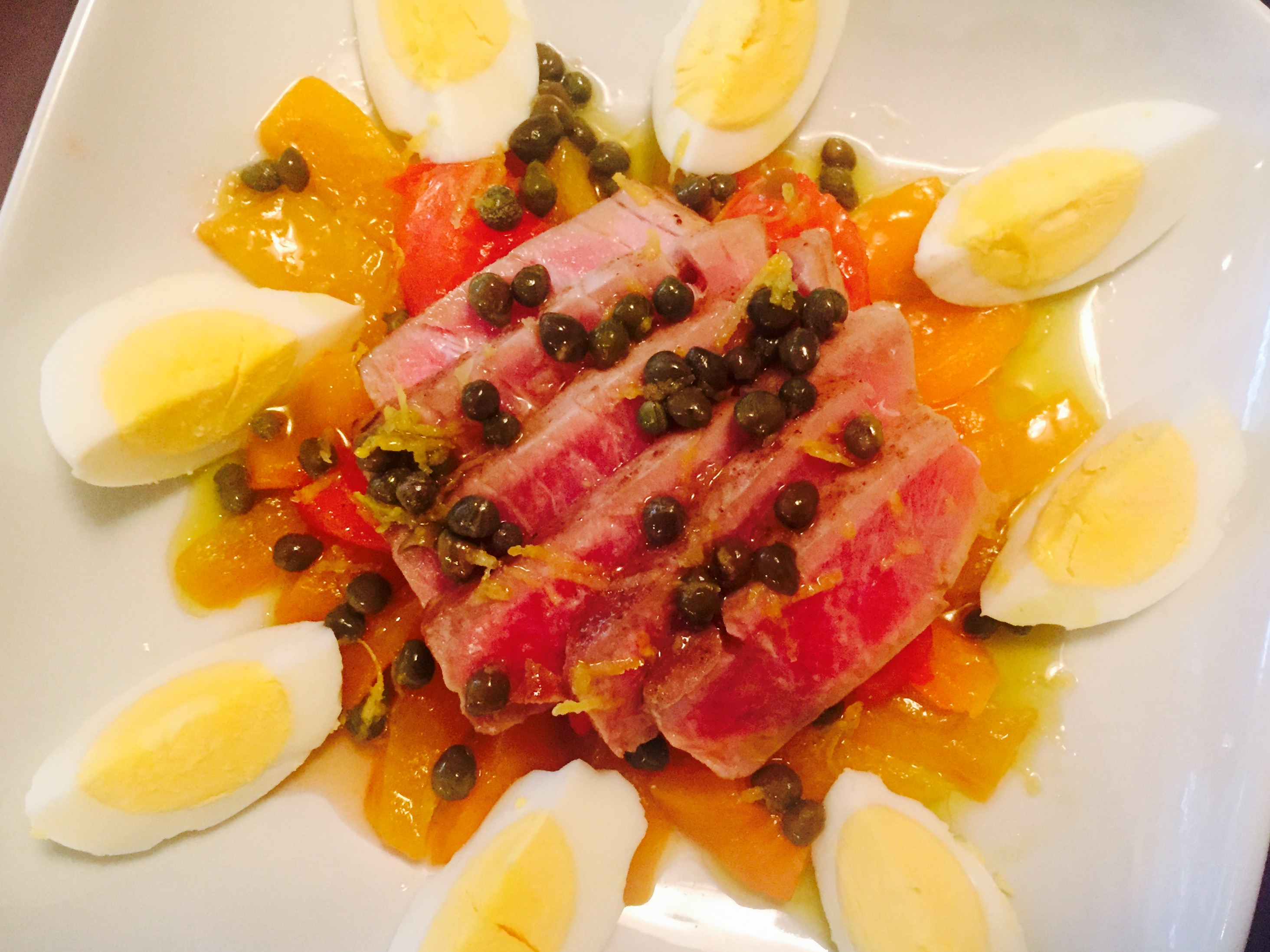 Tunisian Mechouia salad with steered tuna, roasted peppers, broiled tomatoes and a zesty lemon & caper vinaigrette