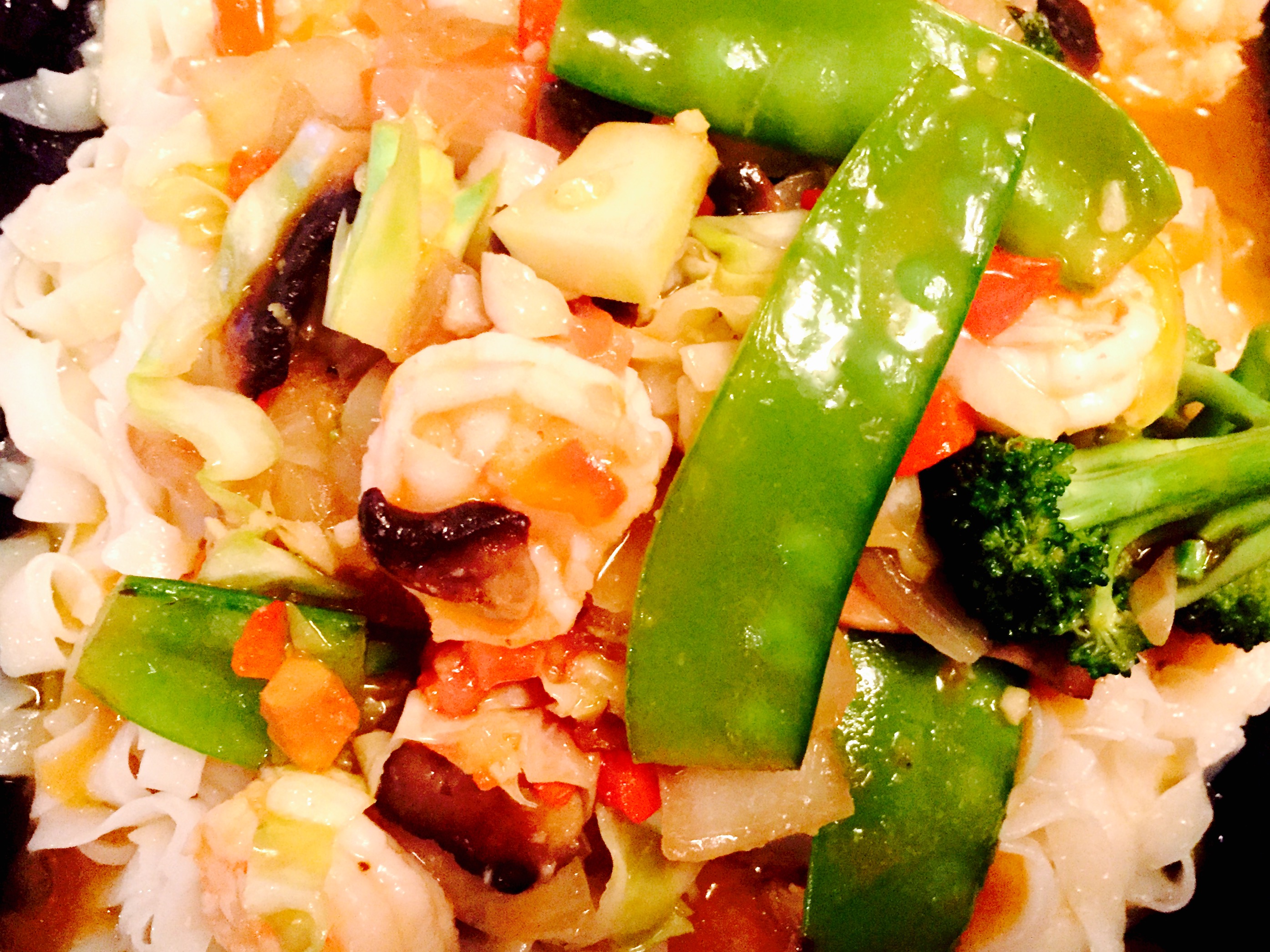 Shrimp pad thai with fresh garden vegetables and a sweet and spicy soy free sauce
