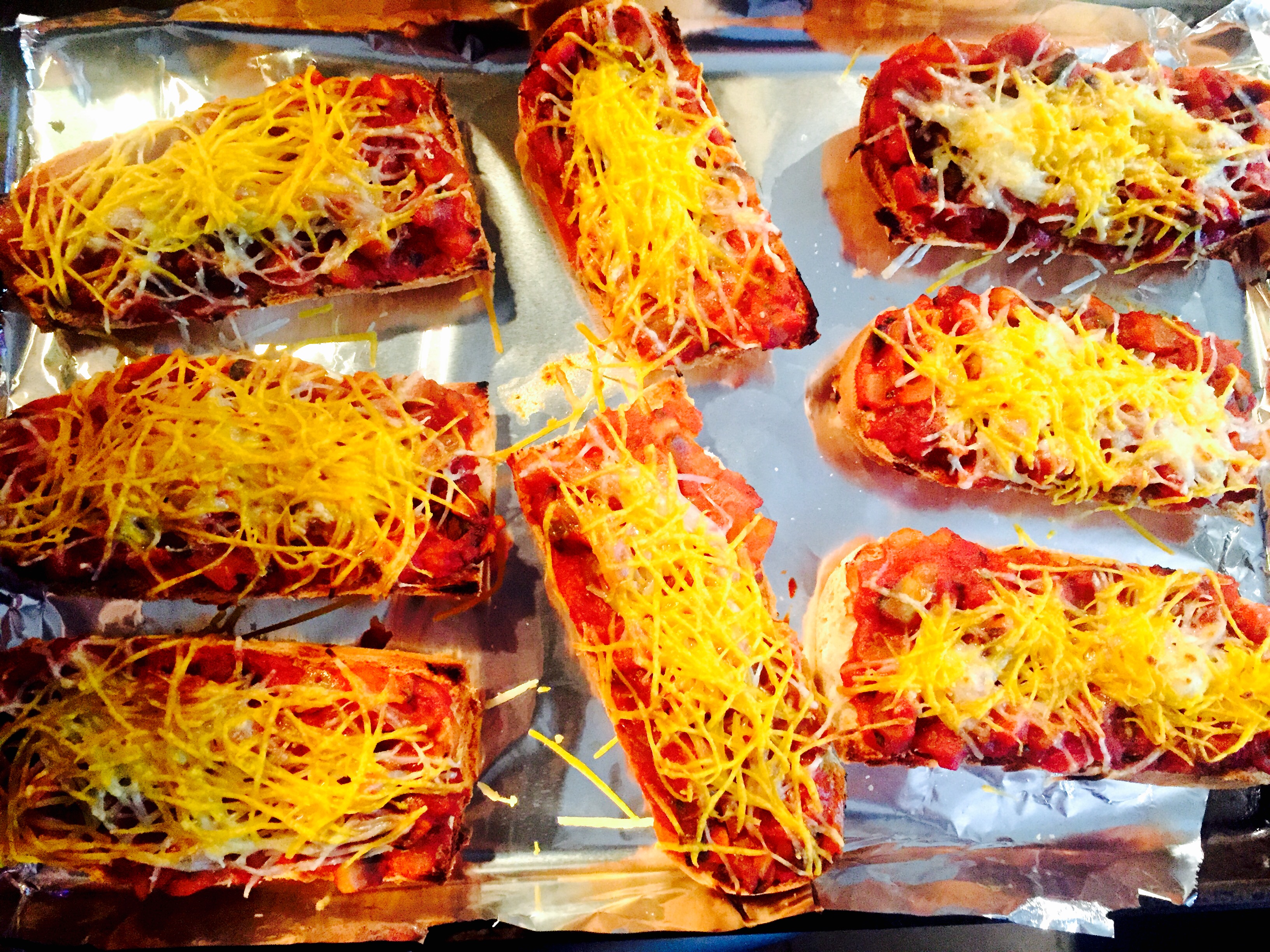 Ultimate comfort food ... Spaghetti sauce on gluten free baguettes with dairy free grated cheese broiled to perfection