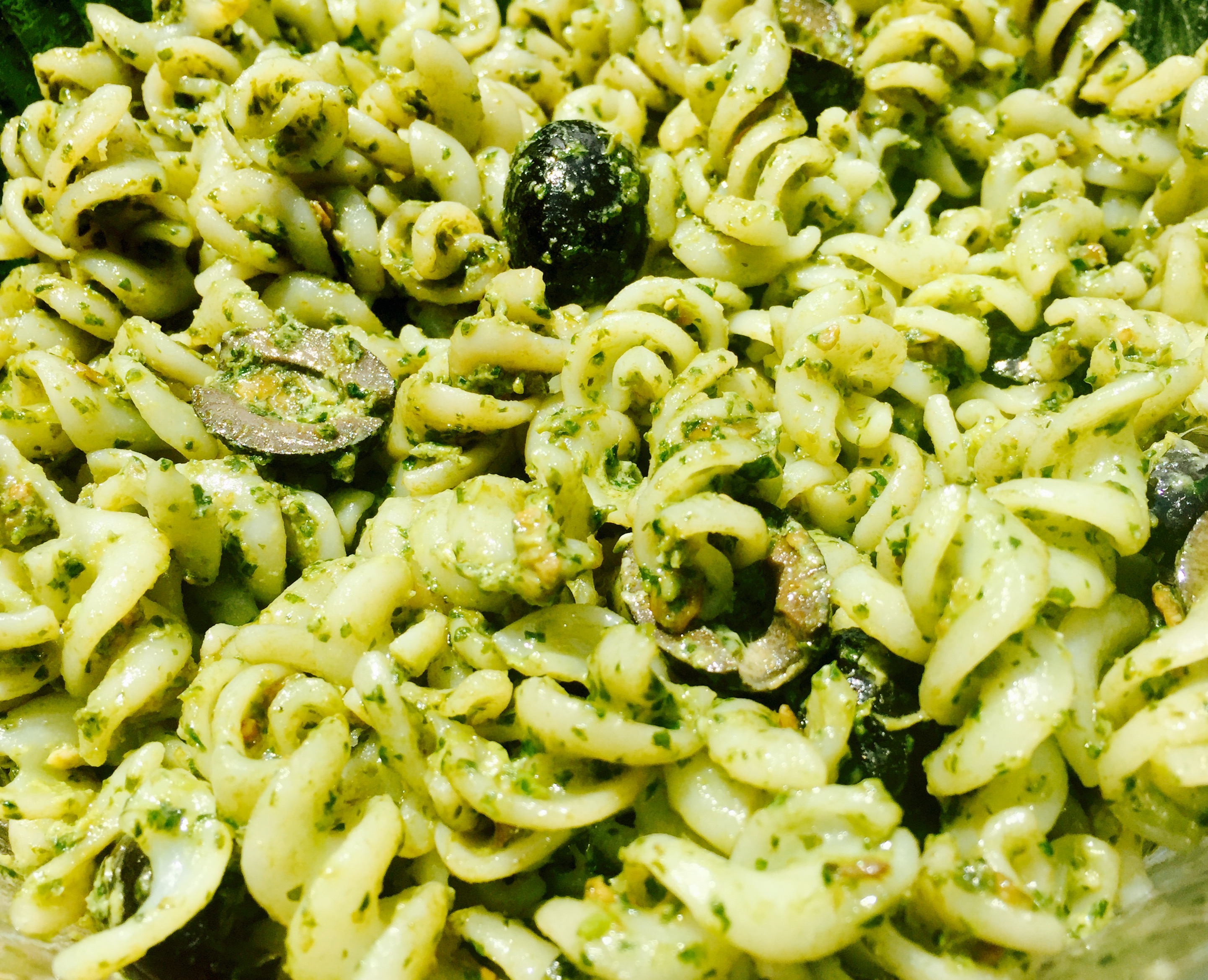 My dairy free, gluten free pesto pasta salad recipe with black olives is a delicious addition to any summer feast