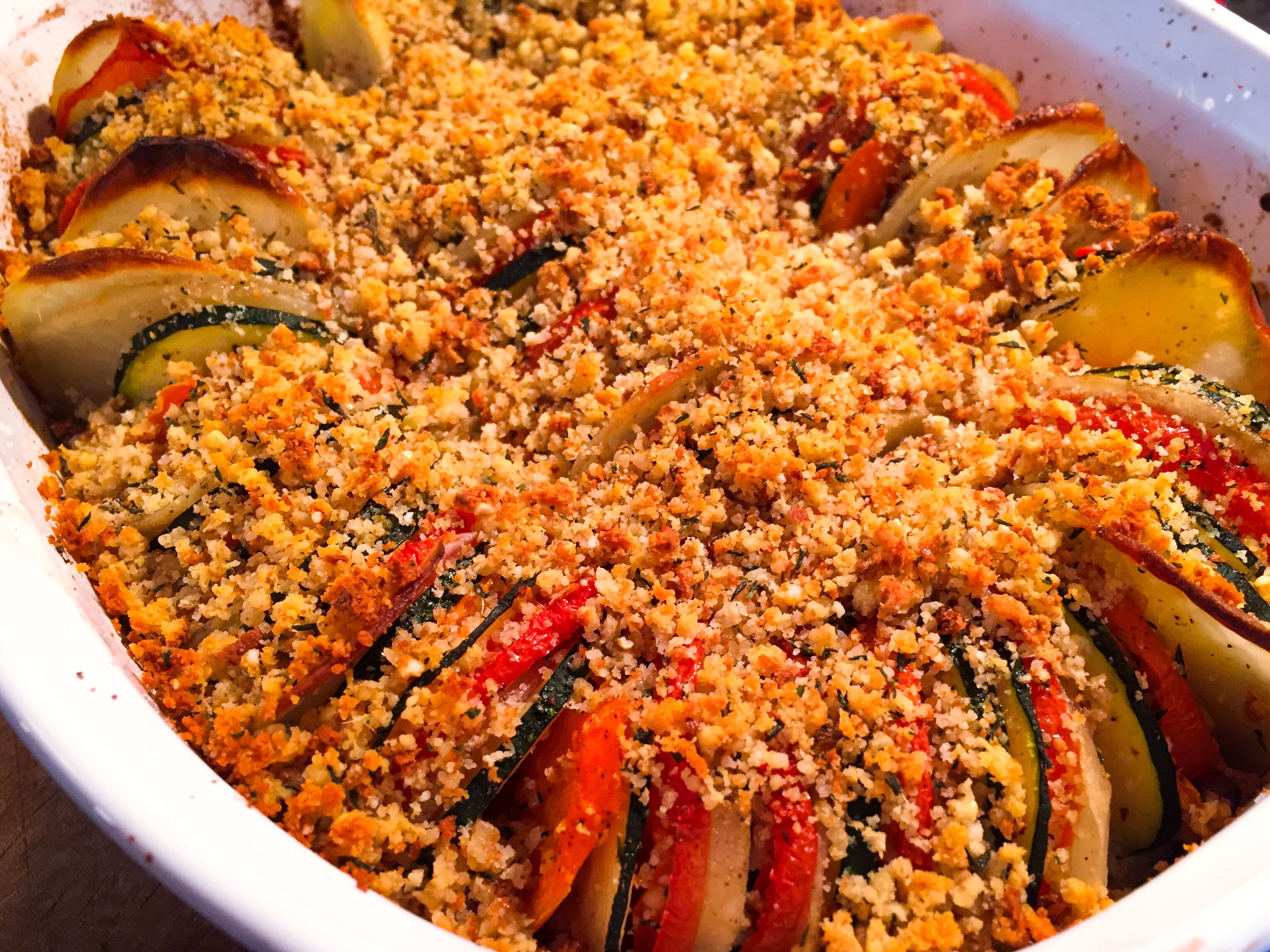 Delicious roasted vegetable tian with an herbed gluten free bread crumb topping